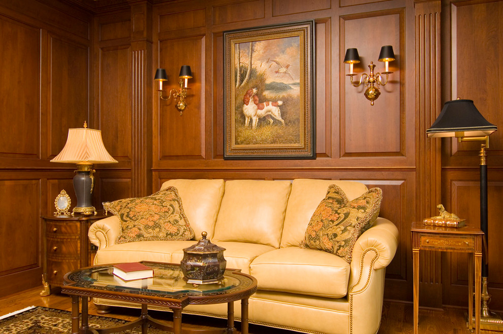 Идея дизайна: изолированная гостиная комната среднего размера в классическом стиле с с книжными шкафами и полками, паркетным полом среднего тона, стандартным камином, фасадом камина из дерева и коричневым полом
