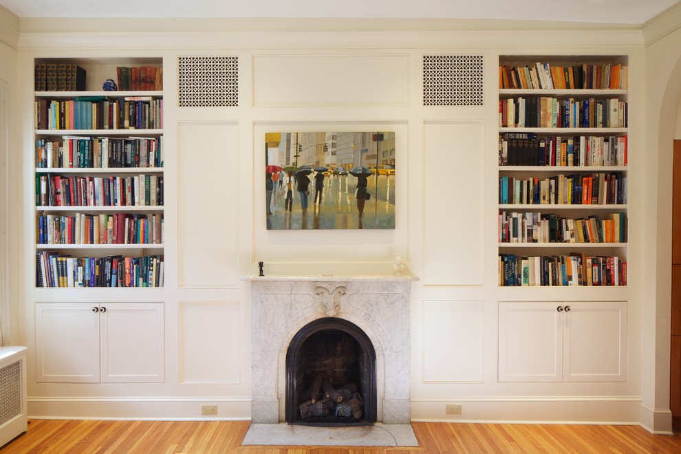 Living room library - mid-sized contemporary light wood floor living room library idea in Philadelphia with beige walls and a stone fireplace