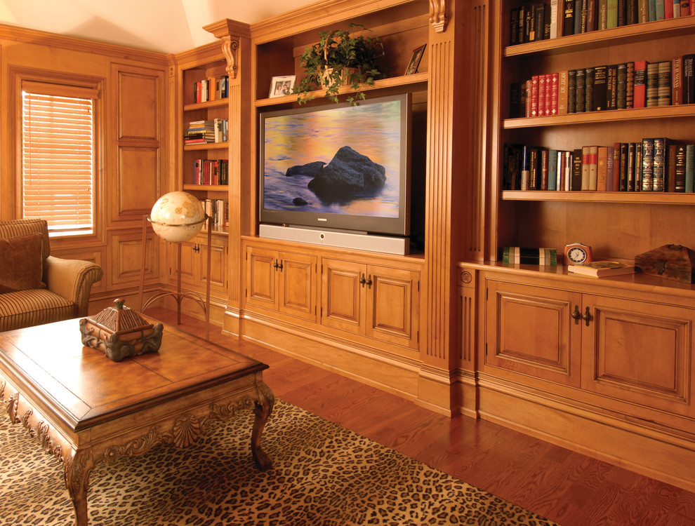 This is an example of a medium sized traditional formal enclosed living room in New York with beige walls, dark hardwood flooring, no fireplace, a built-in media unit and brown floors.