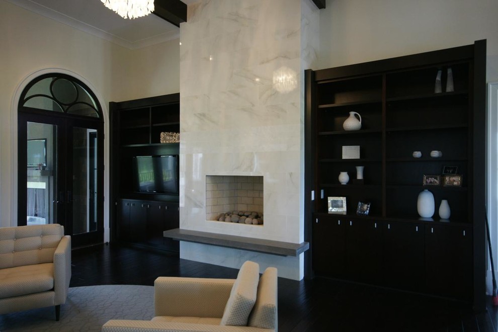 This is an example of a large contemporary open plan living room in Other with white walls, dark hardwood flooring, a tiled fireplace surround and a wall mounted tv.