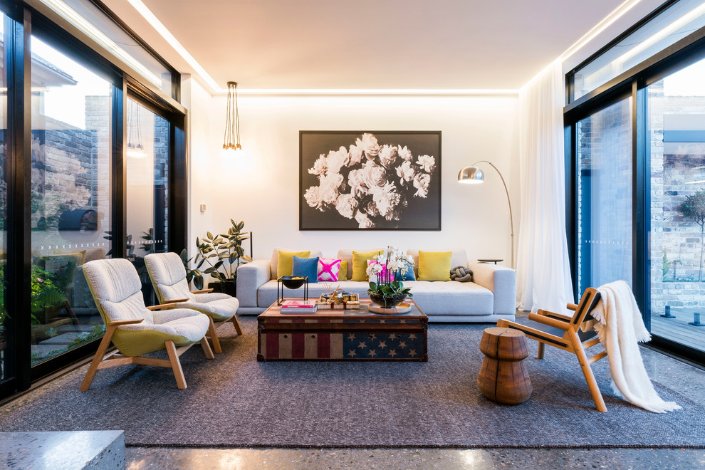 Foto di un soggiorno minimal di medie dimensioni con pavimento in cemento