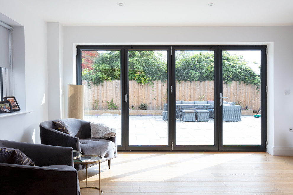 This is an example of a medium sized contemporary living room in Berkshire with grey walls.