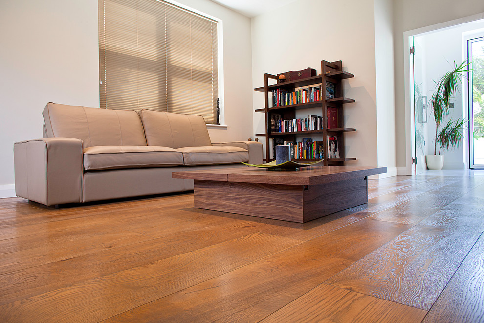 Design ideas for a modern living room in London with dark hardwood flooring.