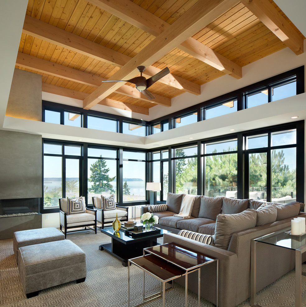 This is an example of a contemporary living room in Vancouver with a ribbon fireplace.