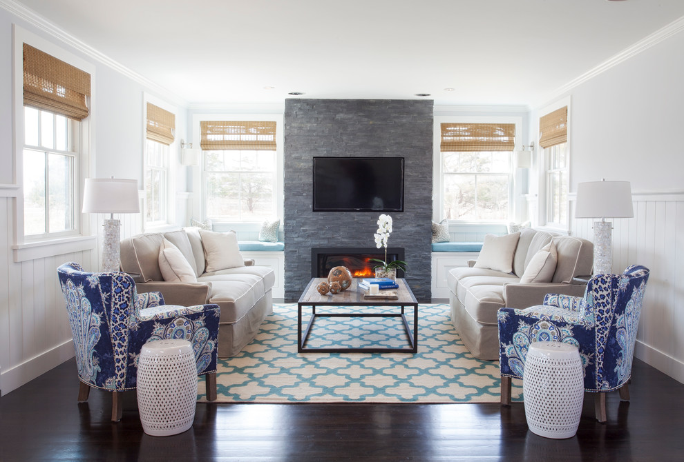 Design ideas for a medium sized nautical living room in Boston with white walls, dark hardwood flooring, a ribbon fireplace, a stone fireplace surround and a wall mounted tv.