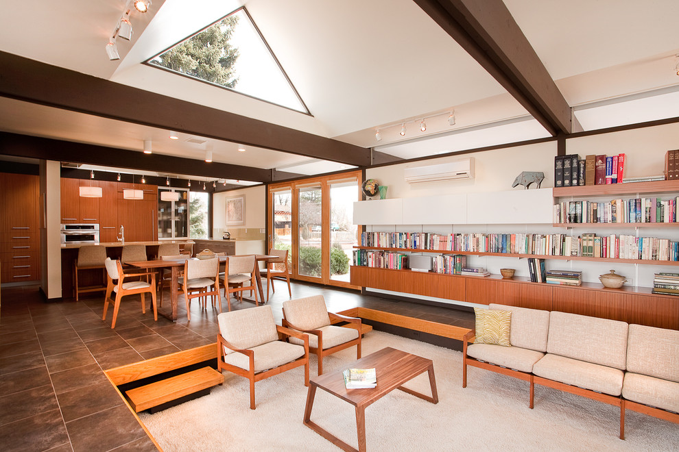 Inspiration for a modern open concept living room library remodel in Denver