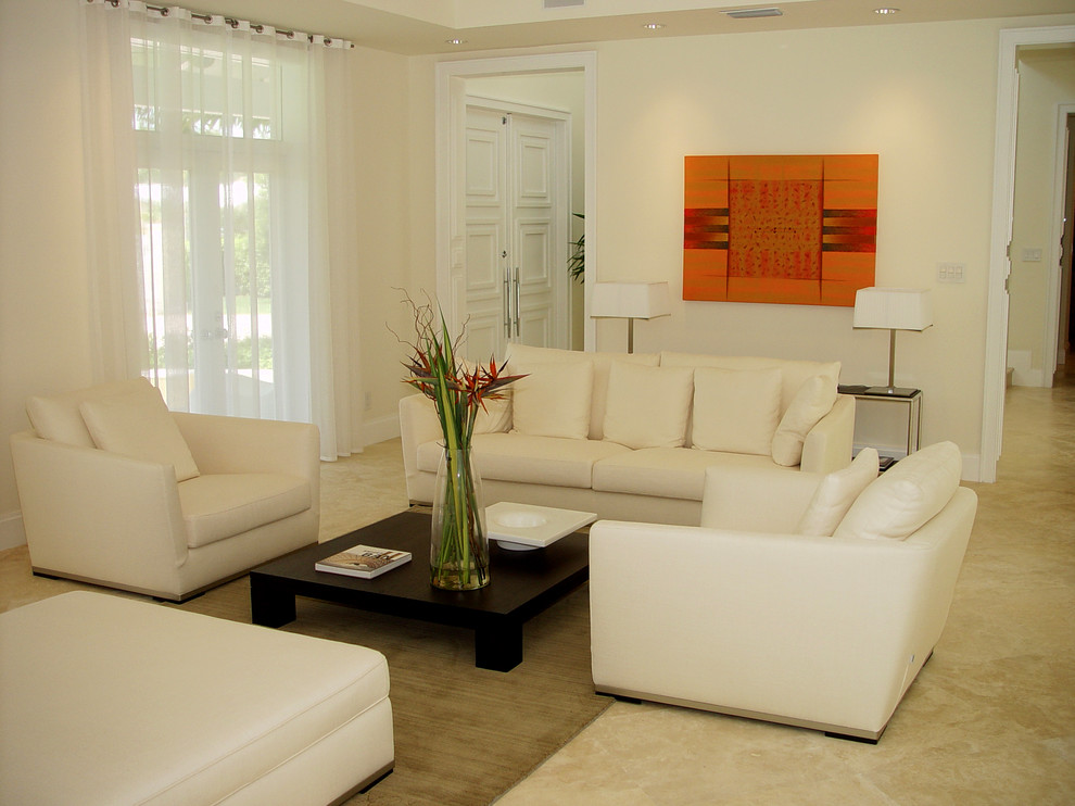 Example of a mid-sized formal and enclosed marble floor living room design in Miami with white walls