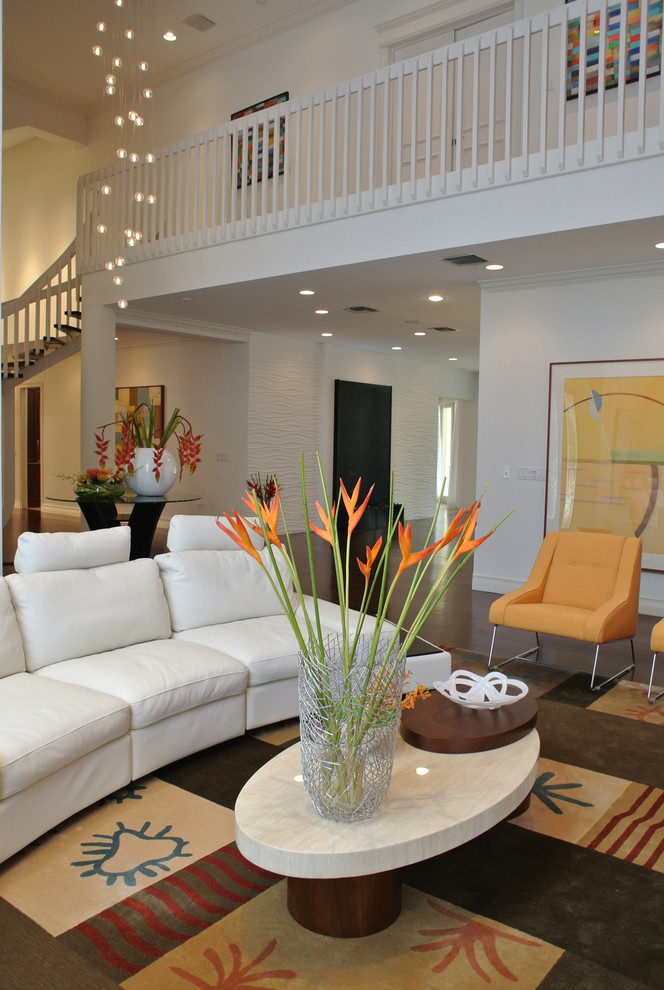 Example of a trendy formal and open concept living room design in Miami with white walls