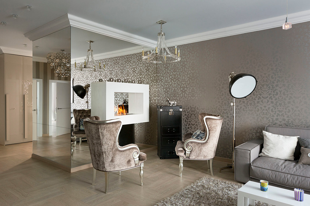 Источник вдохновения для домашнего уюта: открытая гостиная комната в современном стиле с серыми стенами