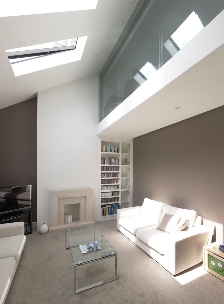 Living room - mid-sized contemporary formal and loft-style carpeted living room idea in London with gray walls, a standard fireplace, a stone fireplace and a tv stand