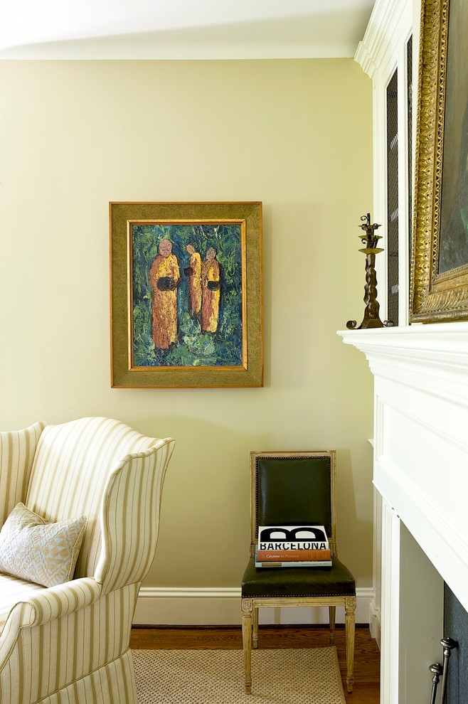 Classic formal enclosed living room in New York with green walls.