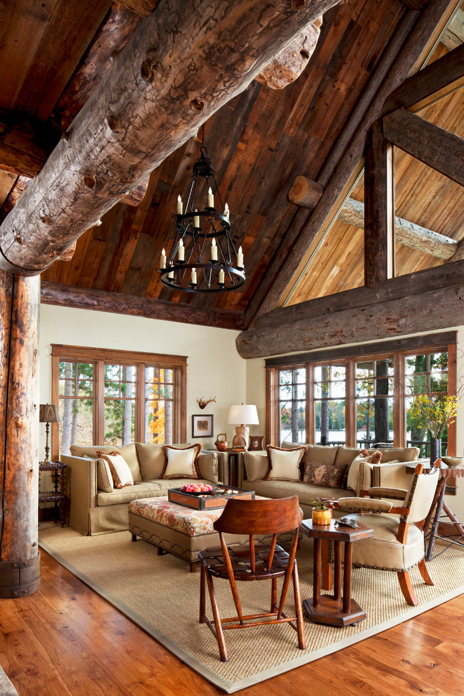 Inspiration for a medium sized rustic formal open plan living room in Detroit with no tv, white walls, medium hardwood flooring and feature lighting.