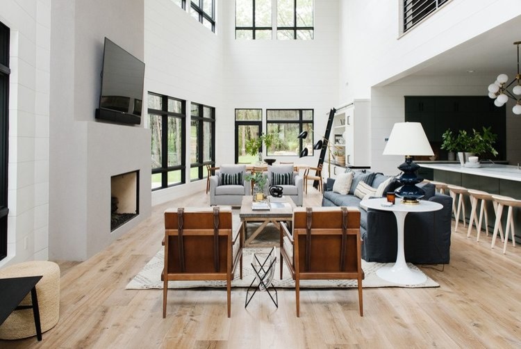 This is an example of a medium sized open plan living room in Salt Lake City with white walls, light hardwood flooring and a standard fireplace.