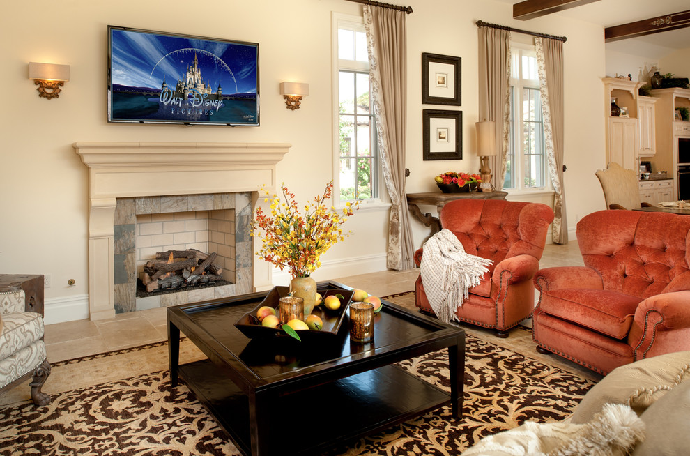 This is an example of a medium sized classic formal open plan living room in Orlando with beige walls, a standard fireplace and a wall mounted tv.
