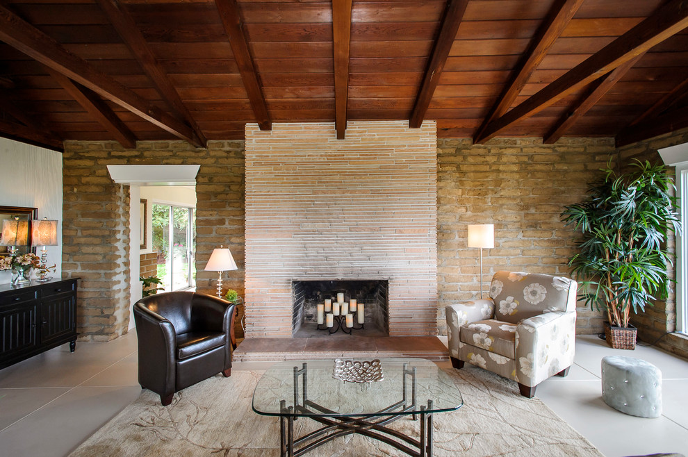 Inspiration for a timeless gray floor living room remodel in San Francisco with a stone fireplace and a standard fireplace