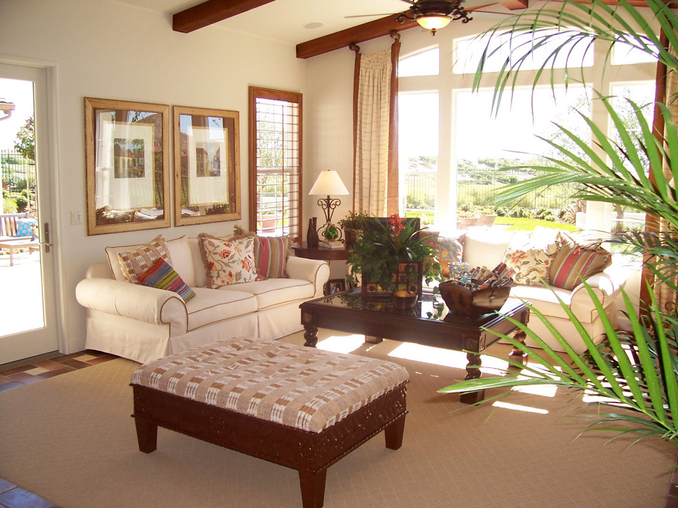 Medium sized beach style open plan living room in San Francisco with white walls and terracotta flooring.