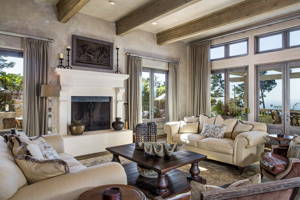 This is an example of a large rustic open plan living room in Orange County with grey walls, dark hardwood flooring, a standard fireplace, a concrete fireplace surround, brown floors and no tv.