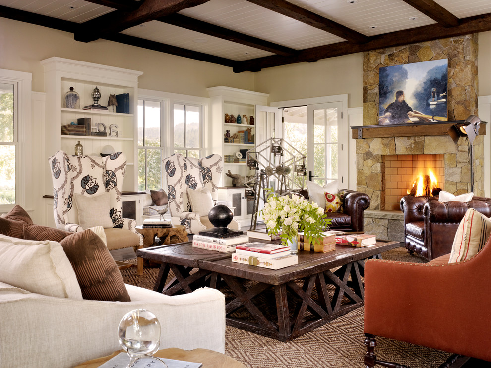 Farmhouse living room in San Francisco with a standard fireplace and a stone fireplace surround.