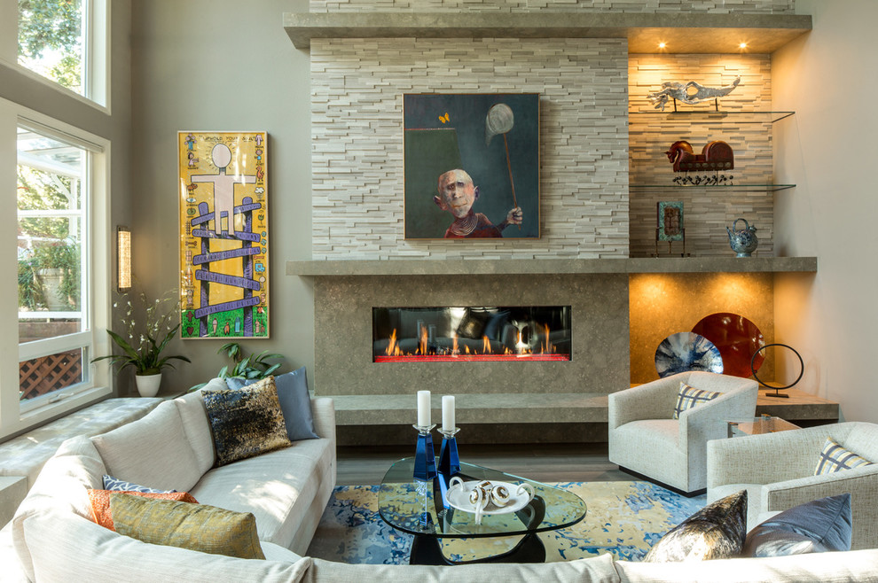 Photo of a contemporary formal living room in Portland with beige walls, a ribbon fireplace, a stone fireplace surround, no tv, dark hardwood flooring and brown floors.