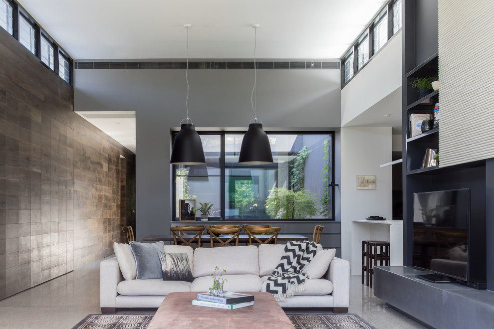 Living room - large modern open concept concrete floor living room idea in Melbourne with gray walls, a standard fireplace, a tile fireplace and a tv stand
