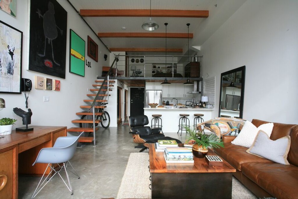 Design ideas for an industrial living room in Vancouver with white walls and no fireplace.