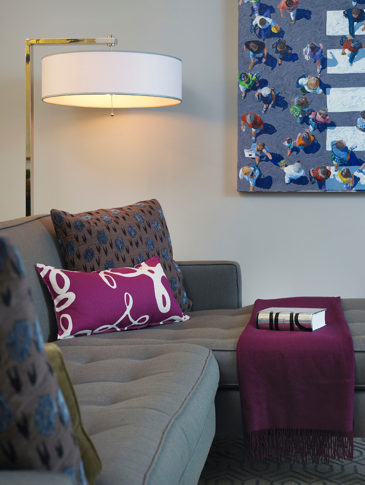 Example of a mid-sized trendy enclosed carpeted living room design in Boston with beige walls, no fireplace and no tv