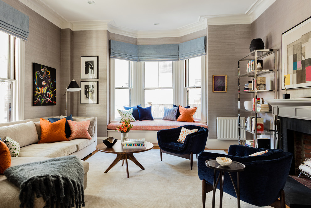 This is an example of a large contemporary formal enclosed living room in Boston with light hardwood flooring, a standard fireplace, a brick fireplace surround, grey walls, no tv and brown floors.