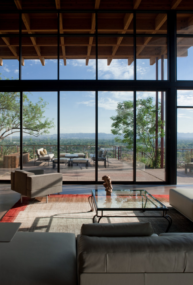 Modernes Wohnzimmer mit Betonboden in Phoenix