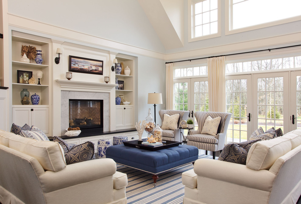 Inspiration for a large coastal enclosed dark wood floor living room remodel in Portland with blue walls, a standard fireplace and a stone fireplace