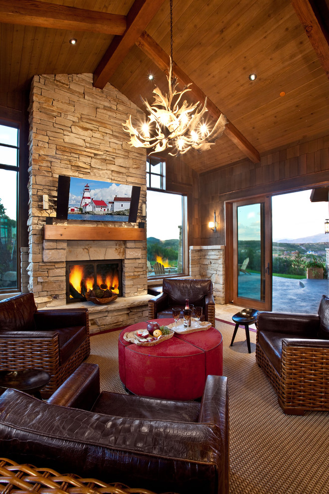 Mountain style living room photo in Salt Lake City with a standard fireplace and a stone fireplace