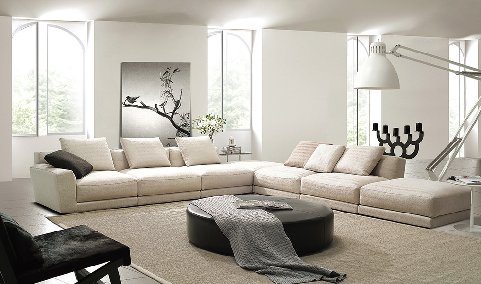 Immagine di un grande soggiorno design stile loft con sala formale, pareti bianche, pavimento con piastrelle in ceramica e nessuna TV