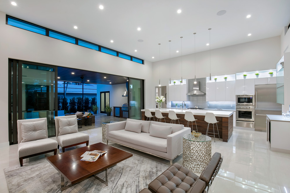 Mid-sized minimalist open concept porcelain tile and white floor living room photo in Tampa with white walls, a ribbon fireplace and a wall-mounted tv