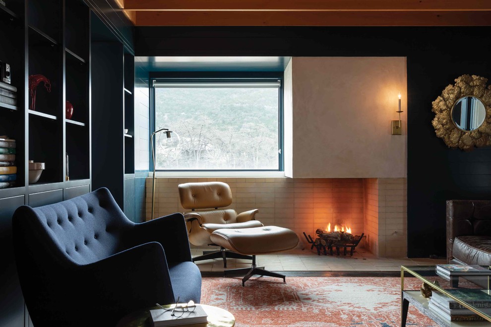 Foto de salón minimalista de tamaño medio sin televisor con paredes azules, suelo de madera oscura, chimenea de doble cara, marco de chimenea de ladrillo y suelo marrón