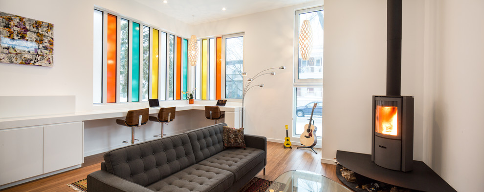This is an example of a modern living room in Ottawa with white walls.