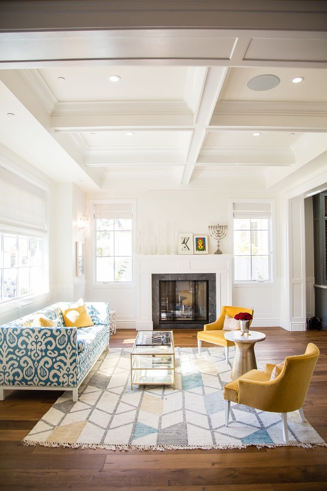 Inspiration for an expansive traditional formal open plan living room in Los Angeles with white walls, medium hardwood flooring, a standard fireplace, a wooden fireplace surround and brown floors.