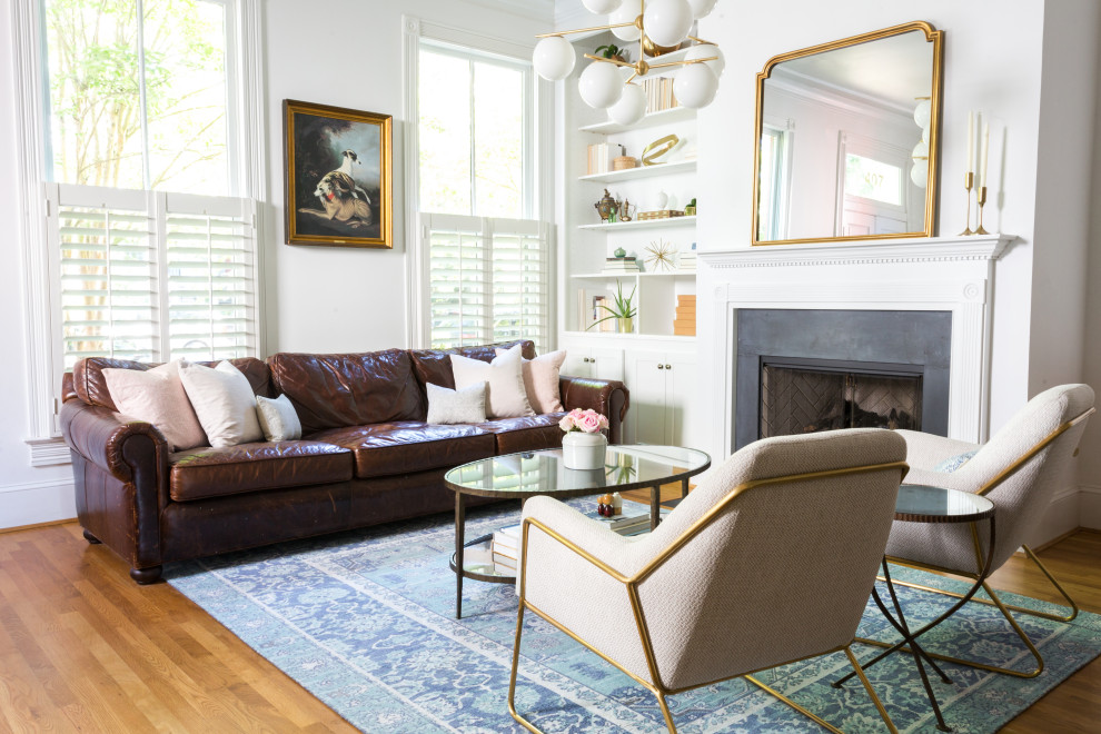 Inspiration for a mid-sized transitional formal and open concept medium tone wood floor and brown floor living room remodel in DC Metro with white walls, a standard fireplace, a tile fireplace and no tv