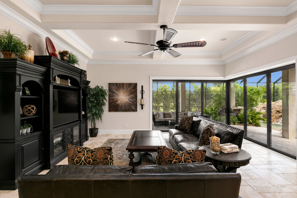 Large mediterranean open plan living room in Orlando with white walls, travertine flooring, no fireplace and a built-in media unit.