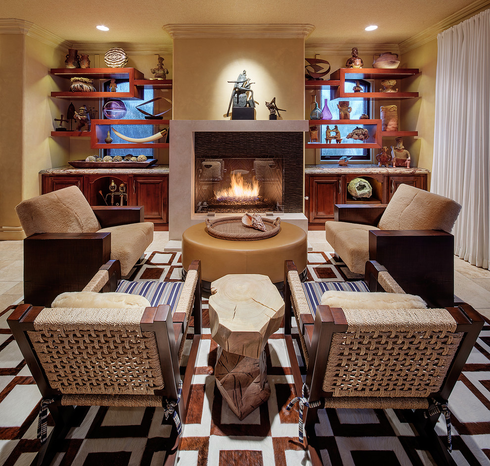 Inspiration for a large world-inspired formal open plan living room in Los Angeles with beige walls, a standard fireplace, travertine flooring, a tiled fireplace surround and beige floors.
