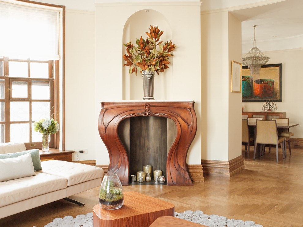 Living room - mid-sized transitional formal and open concept medium tone wood floor living room idea in New York with beige walls, a standard fireplace, a wood fireplace surround and no tv