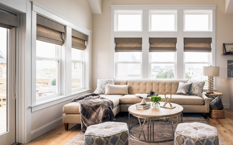 Living room - small modern open concept light wood floor and brown floor living room idea in Other with beige walls