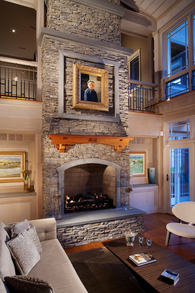 Design ideas for a traditional living room in DC Metro with a stone fireplace surround.