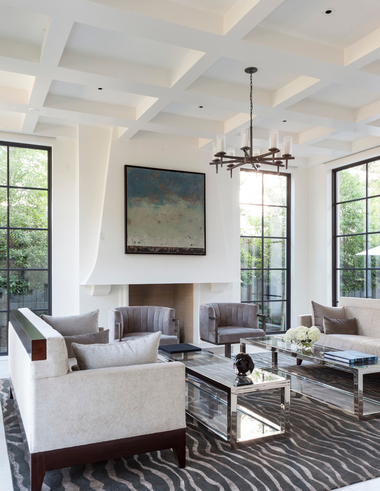 Photo of a mediterranean living room in Dallas with white walls.