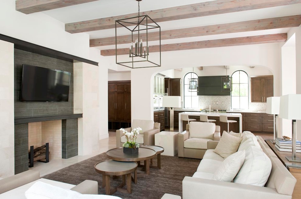 Photo of a contemporary living room in Dallas with a stone fireplace surround and feature lighting.