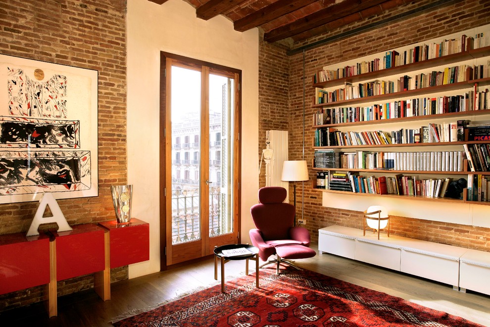 Trendy medium tone wood floor living room photo in Barcelona with orange walls