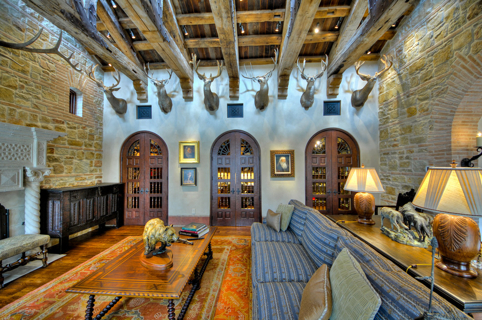 Design ideas for an expansive mediterranean living room in Austin with a standard fireplace.