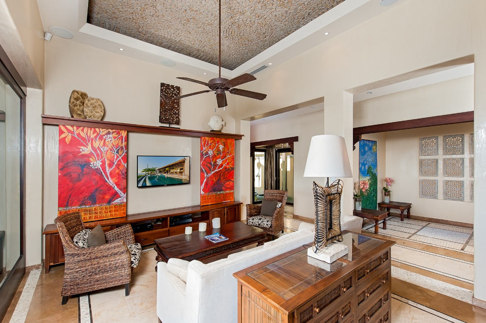 Example of a tuscan multicolored floor living room design in Other with a concealed tv
