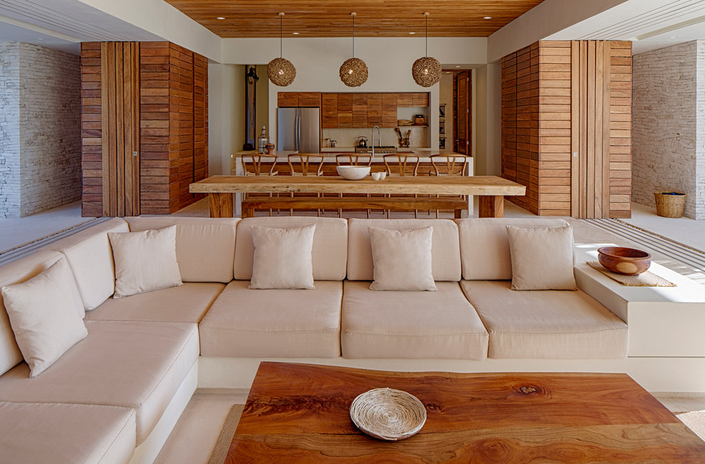 Example of a large island style open concept and formal living room design in Other with gray walls