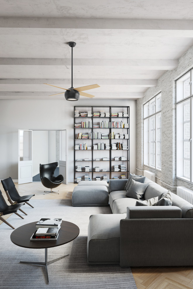 Photo of an expansive industrial open plan living room in New York with white walls, light hardwood flooring, no fireplace and no tv.