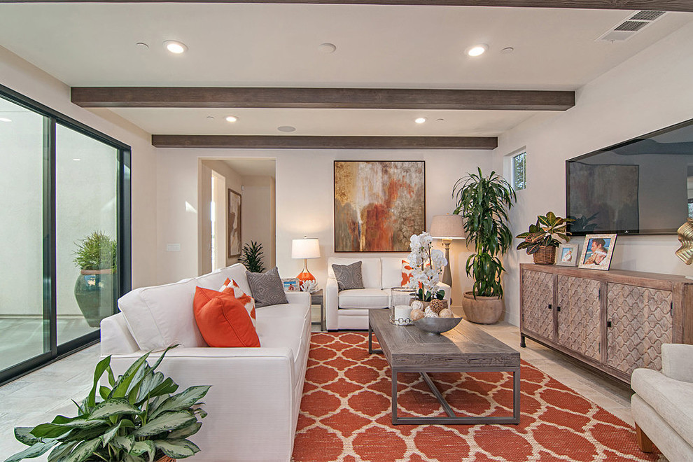 This is an example of a medium sized contemporary open plan living room in San Diego with beige walls, porcelain flooring, no fireplace, a wall mounted tv and beige floors.