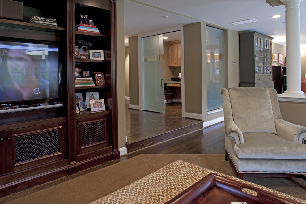 Inspiration for a traditional living room in DC Metro with beige walls and a built-in media unit.